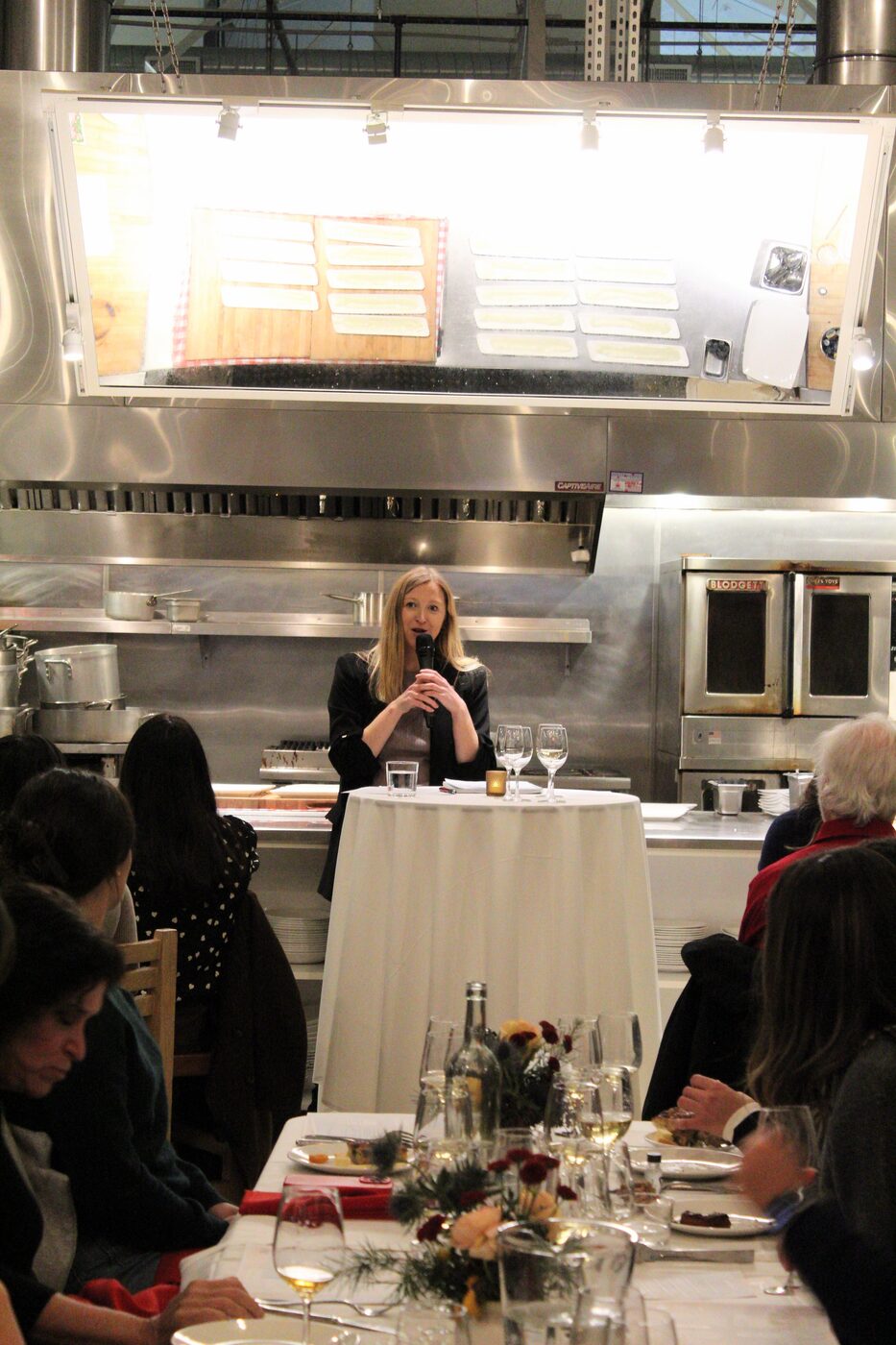 Gina speaking at a wine pairing dinner